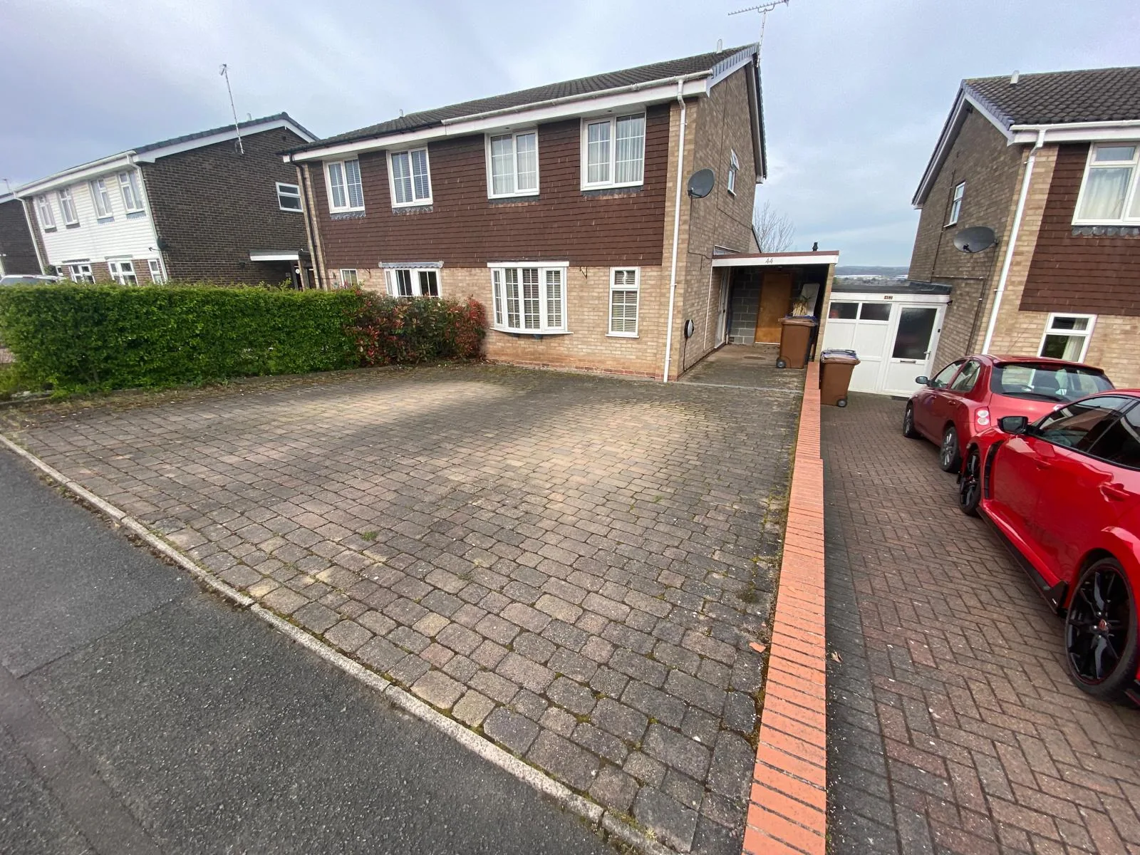 Block paving driveway before cleaning in Kings Bromley