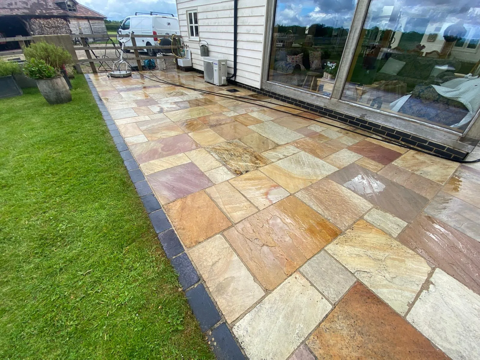 Indian sandstone patio with colours fully restored after cleaning in Sutton Coldfield