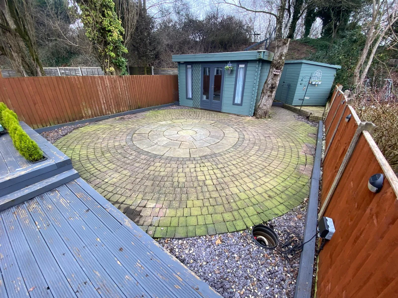Circular patio before cleaning