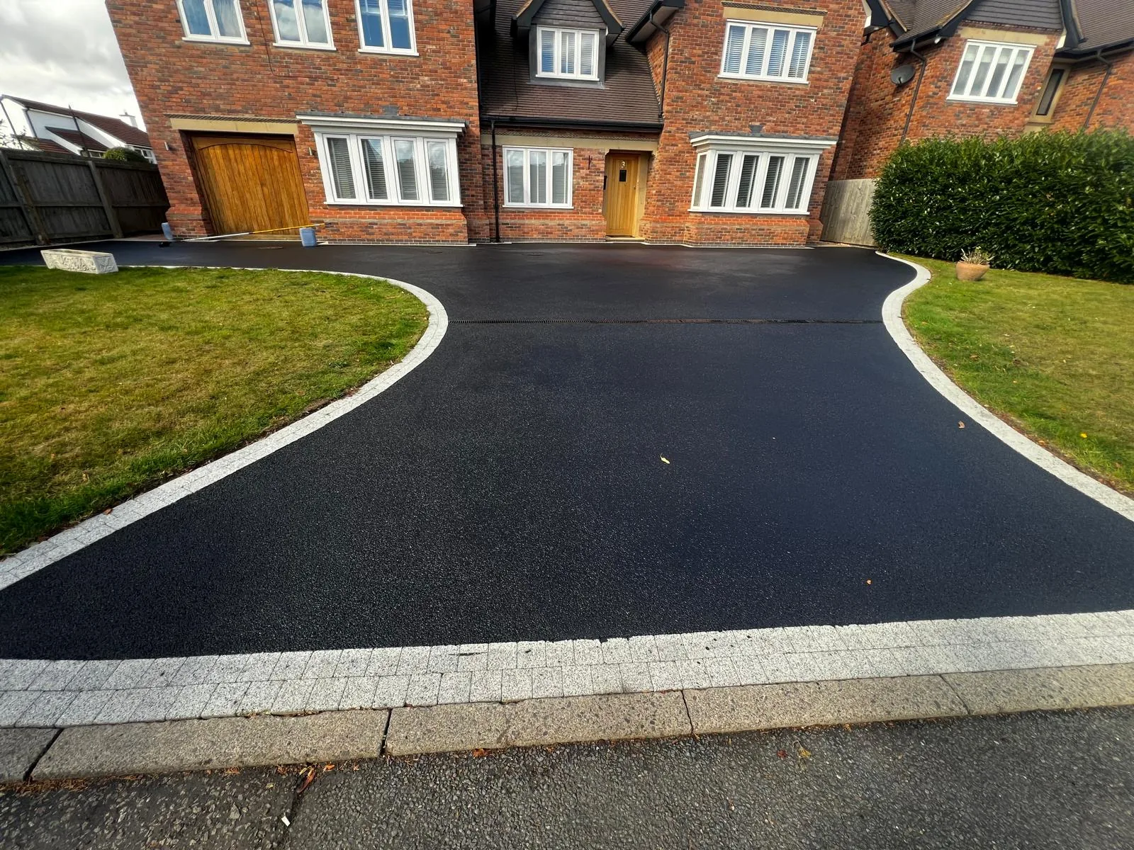 Tarmac driveway restored to jet black after coating
